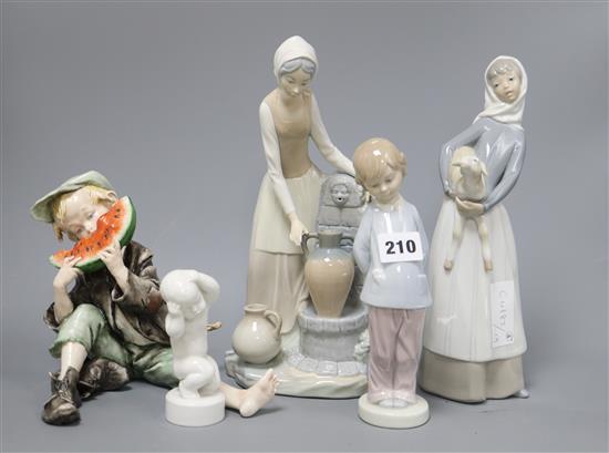 A collection of six Lladro and Nao figures tallest 28cm